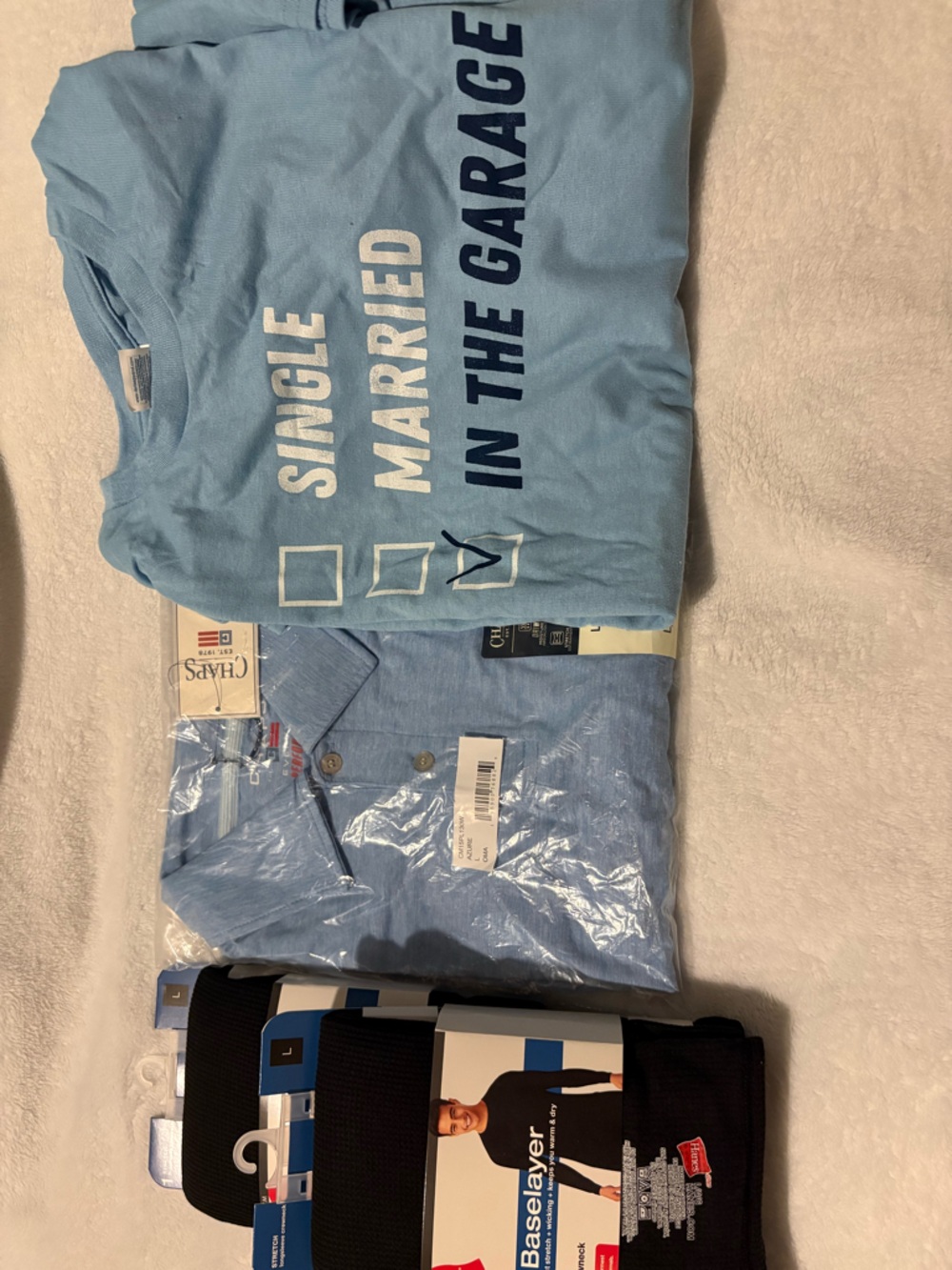 4 piece men’s shirts large and X-Large including a blue chaps